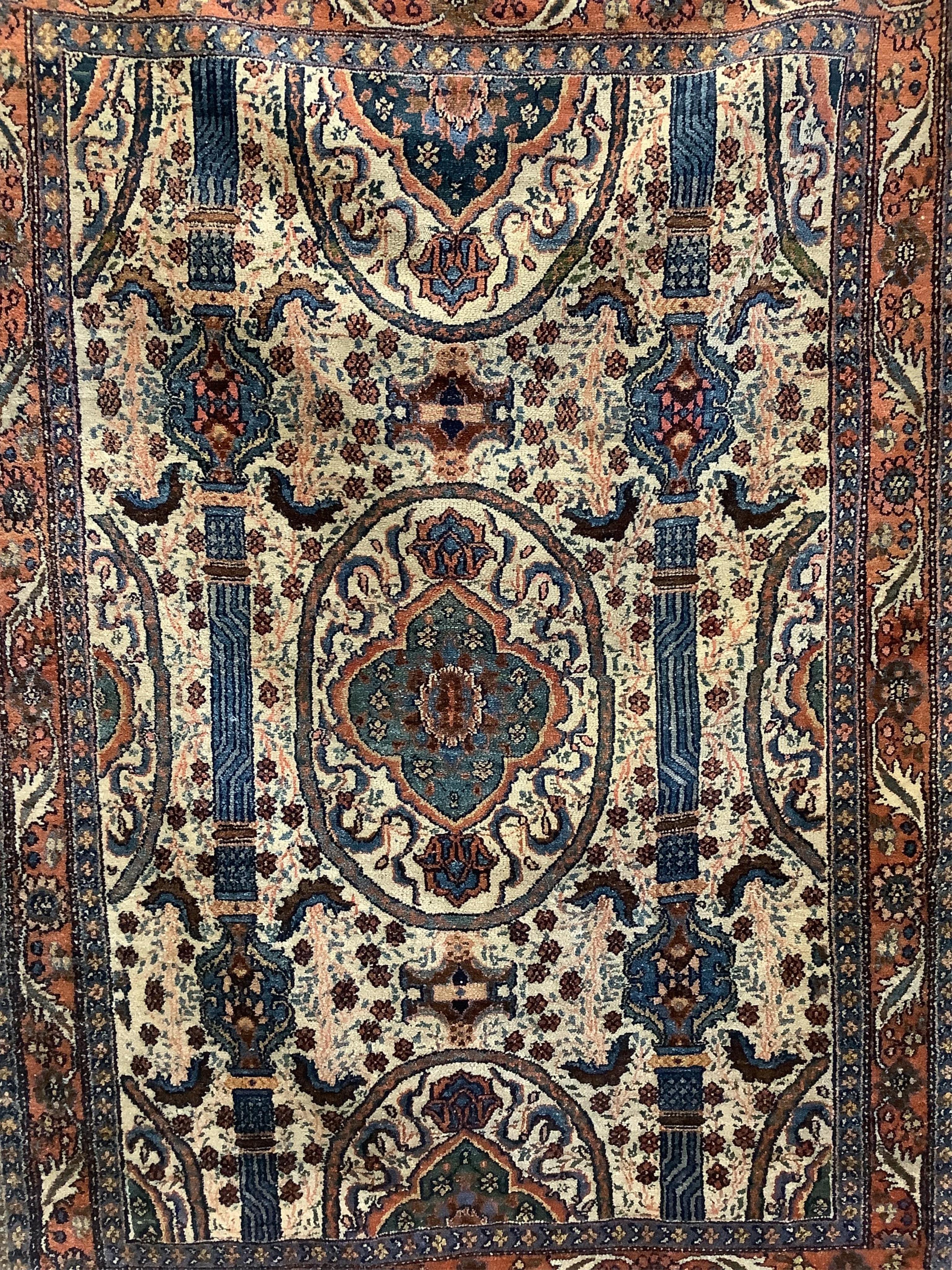 A North West Persian ivory ground rug, 200 x 142cm. Condition - fair